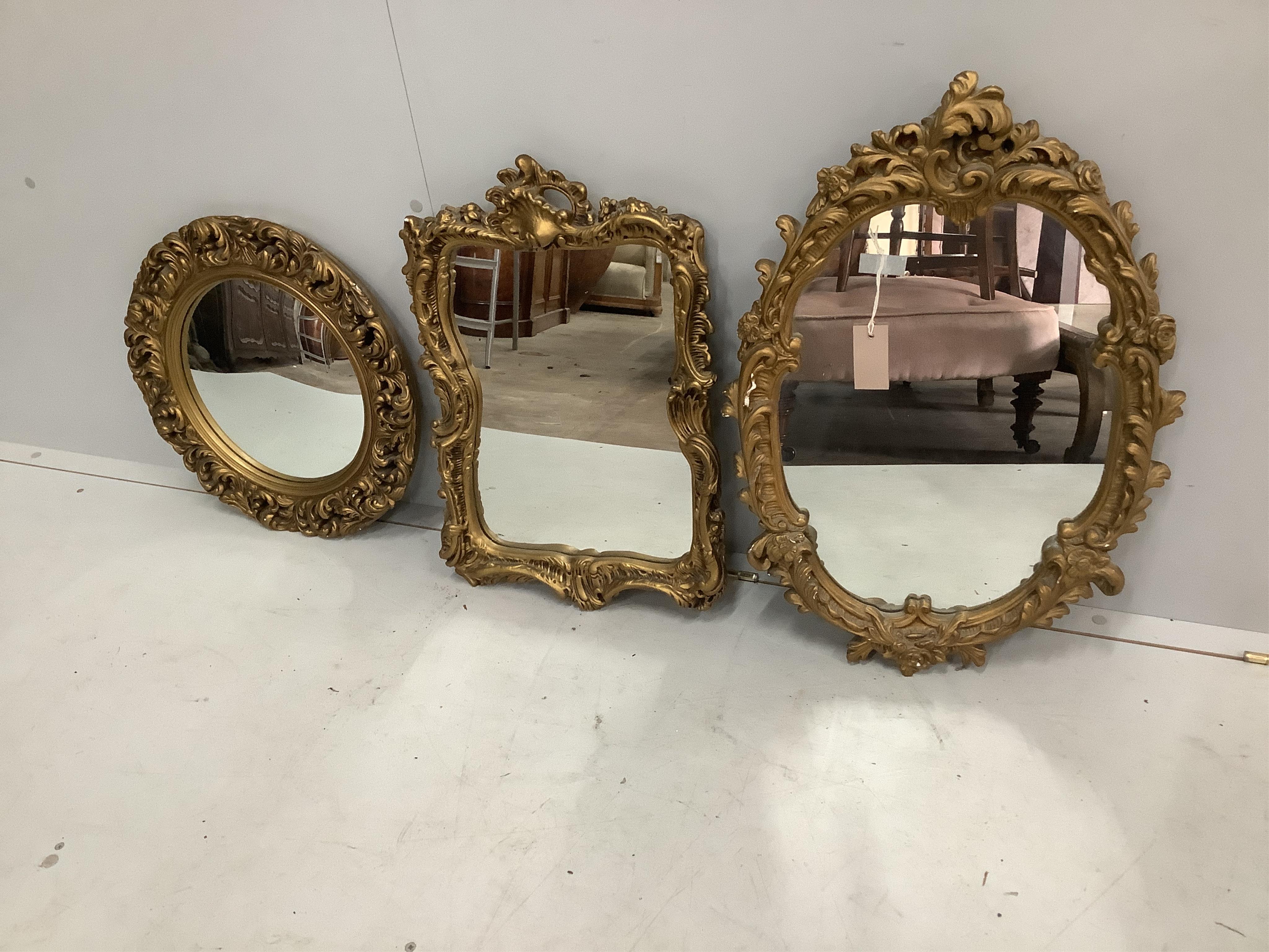 Three Victorian style gilt composition wall mirrors, one convex, largest width 45cm, height 65cm. Condition - fair
